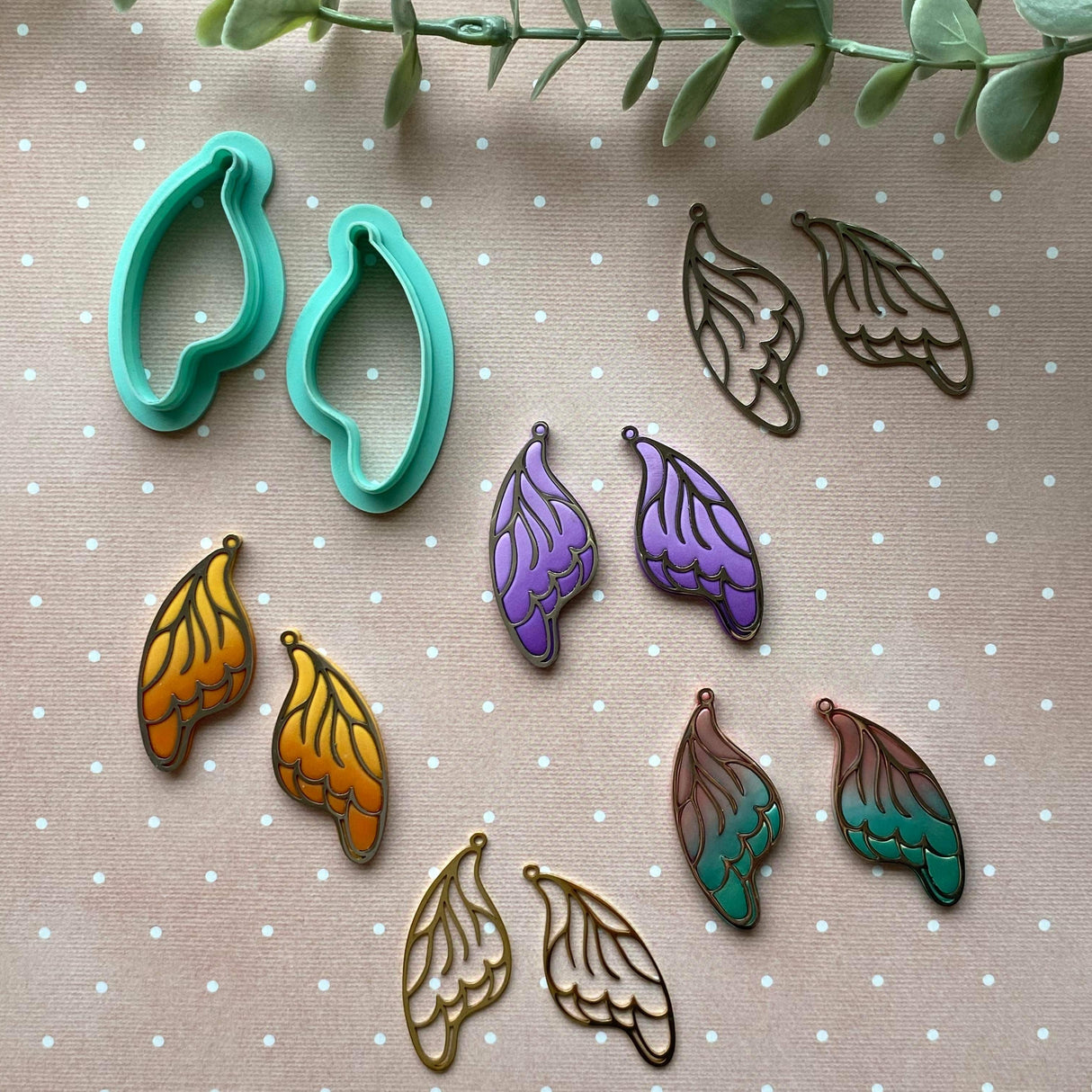 Butterfly wing charms embedded in polymer clay